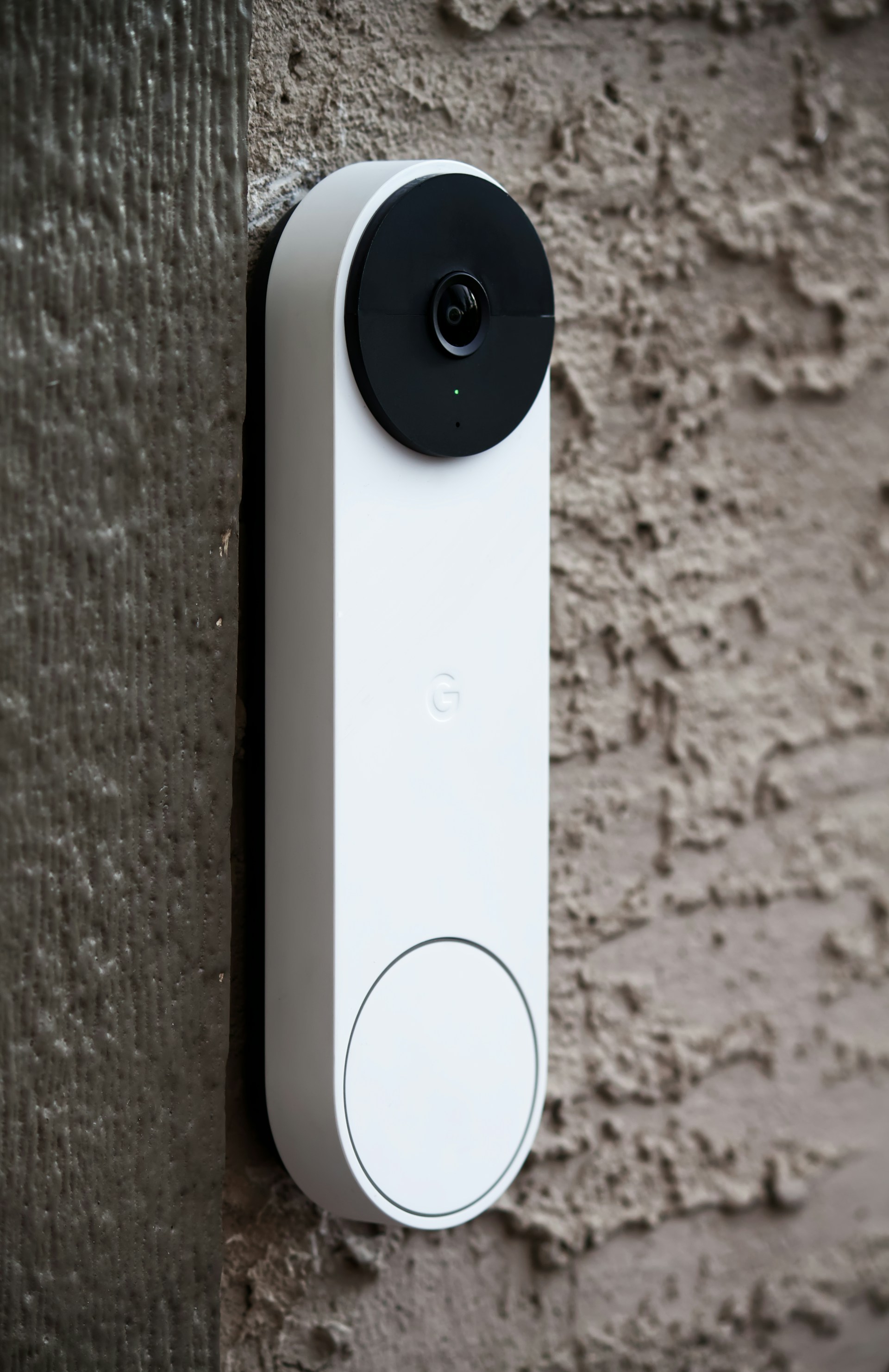 video doorbell against stucco wall